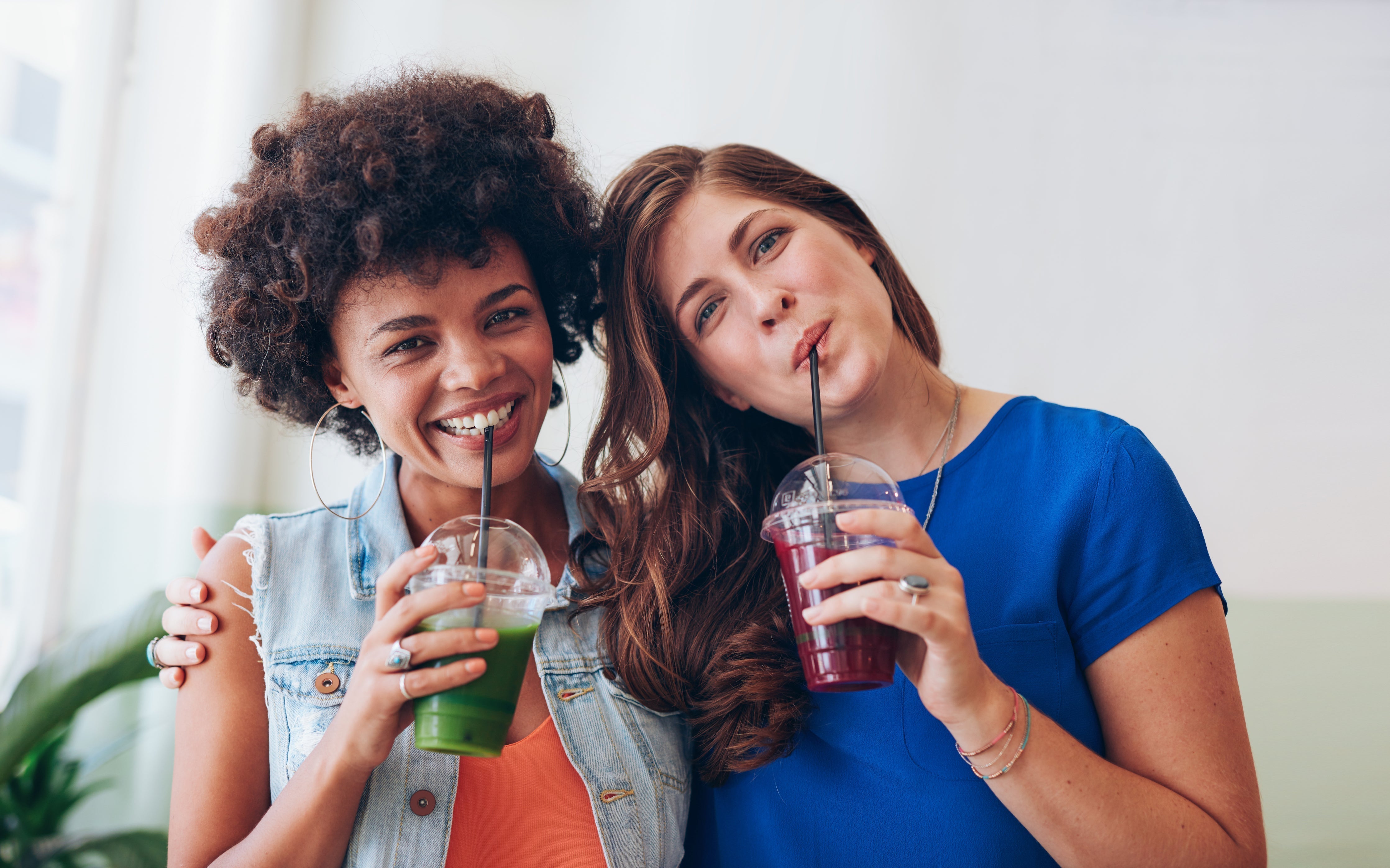 Friends drinking organic cold-pressed fruit and vegetable Living Juice