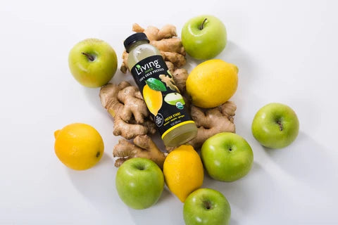 Cold-pressed Living Juice Fresh Start with organic apple lemons and ginger