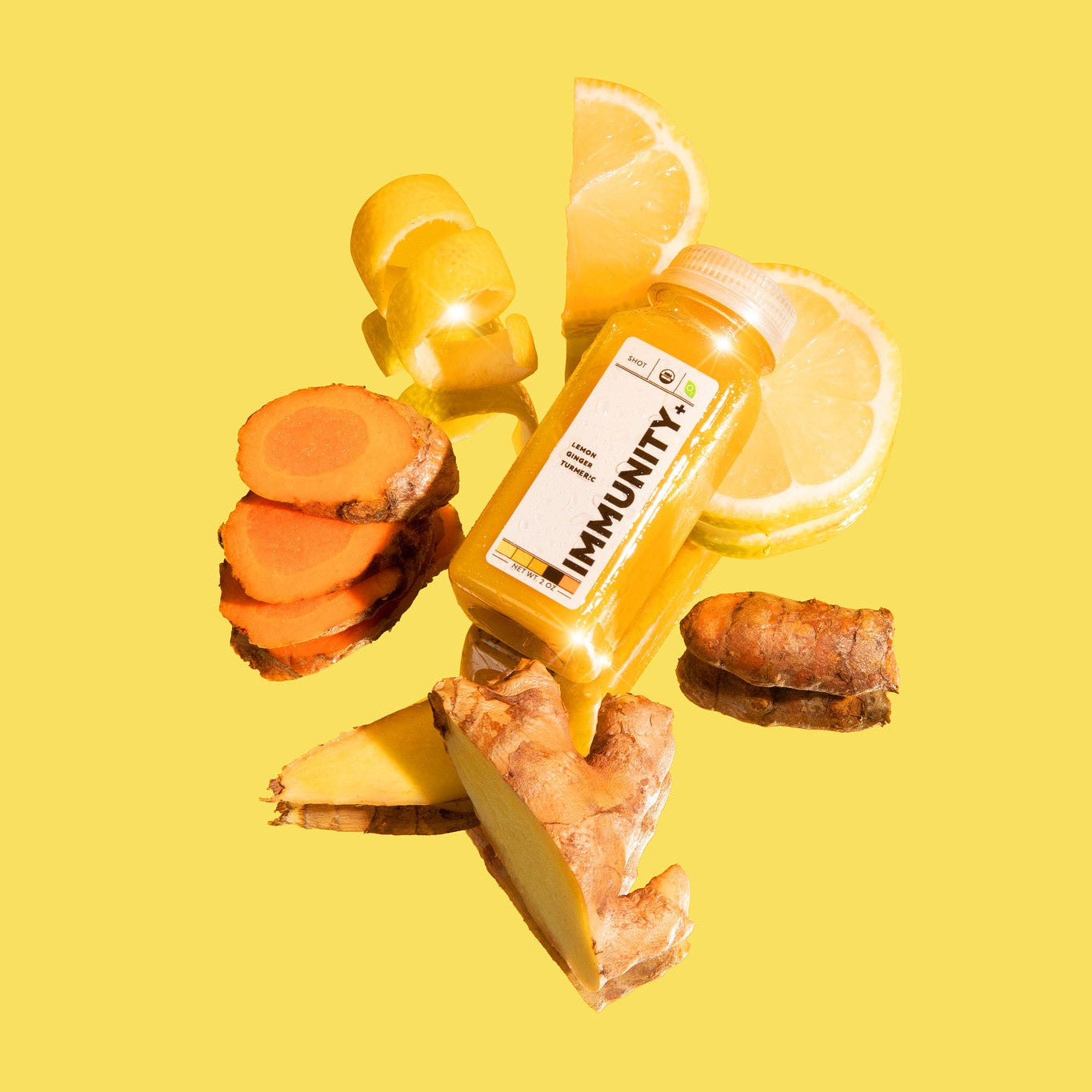 Organic cold-pressed Living Juice Wellness Shot Immunity+ with organic ginger lemon and turmeric