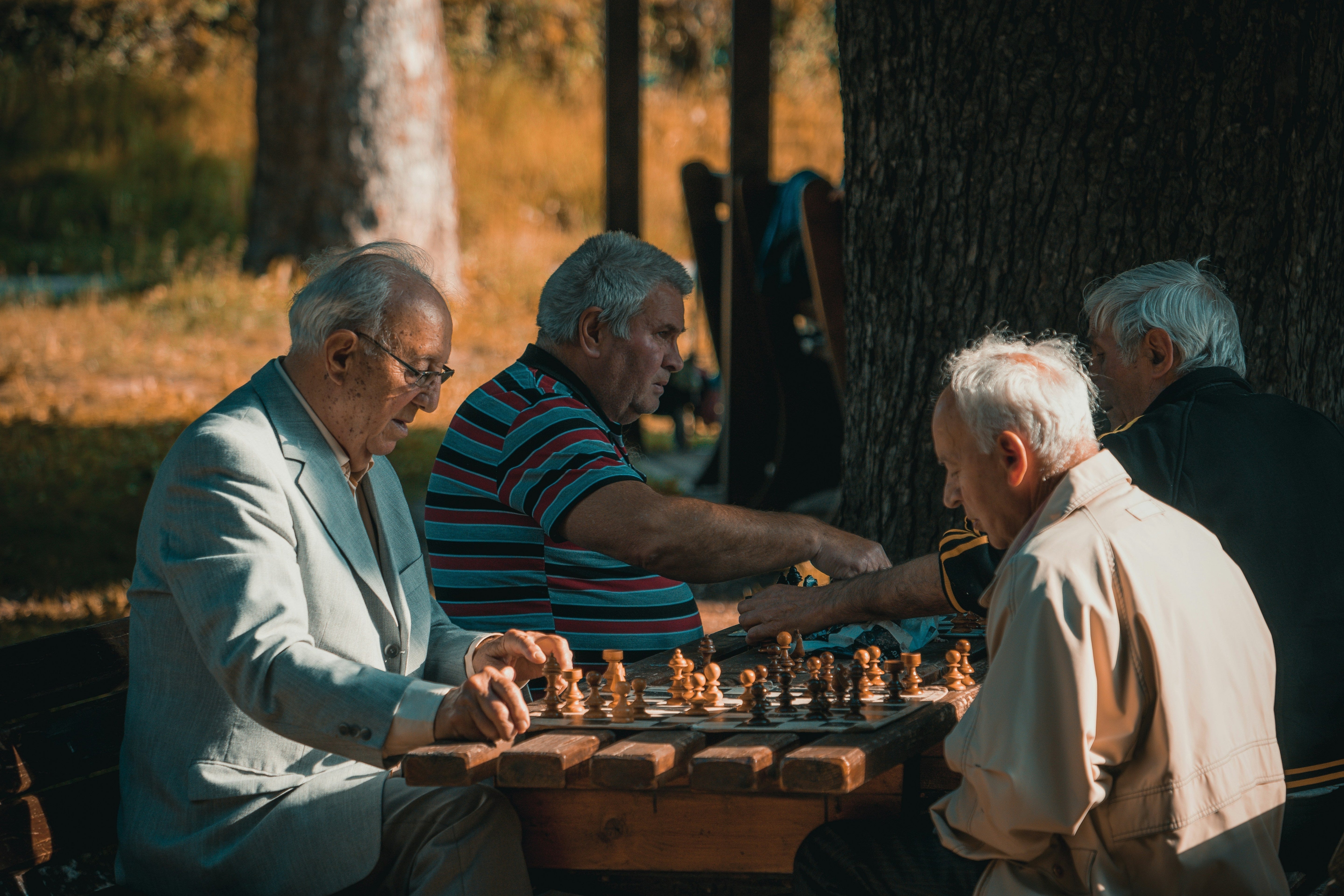 Older men playing chess - longevity blog by Living Juice makers of organic cold-pressed fruit and vegetable Living Juice